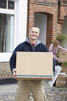 Removal team planning a house move in Barnes on a residential street