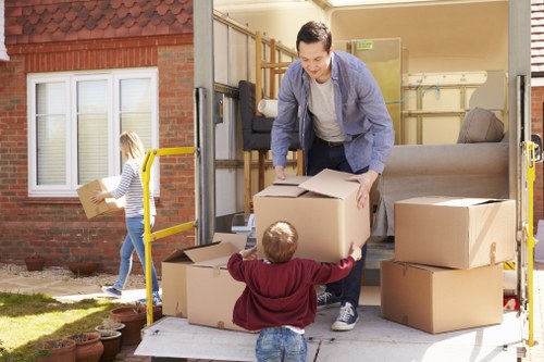 Unloading boxes and furniture into a new home during a Barnes move