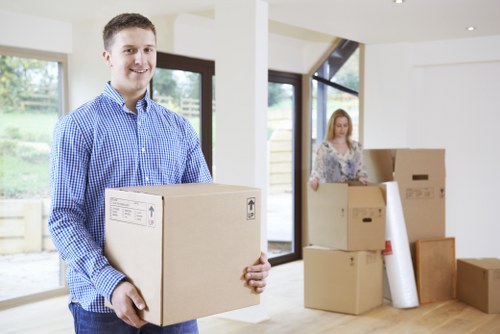 Removal team loading boxes for a same-day move in Barnes