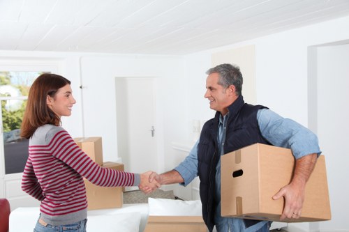 Professional movers loading a van for a Barnes relocation