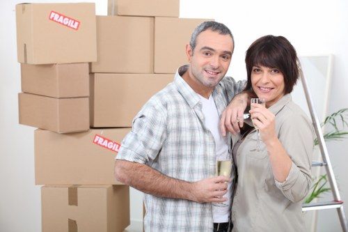 Packed boxes and furniture prepared for a house move in Barnes